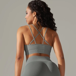 Detailed back view of crisscross straps and ribbed texture on the sports bra set