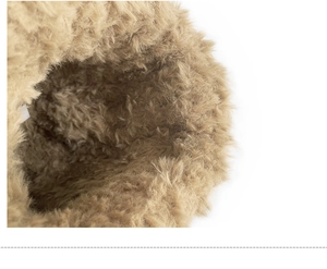 Close-up of thick khaki faux fur lining showing warm and soft knit hat texture