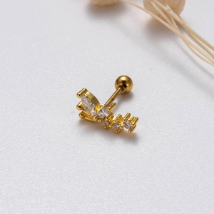 Close-up of golden curved cartilage stud earring with cubic zirconia butterfly design
