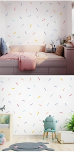 Colorful short striped wall stickers applied on children's bedroom walls for playful decor