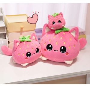 Detailed comparison of three sizes of cute pink strawberry cat plush toys on a desk