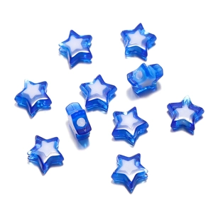 Macro detail of star-shaped translucent blue and white acrylic beads for DIY jewelry