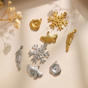 Various 304 stainless steel leaf and snowflake charms in gold and silver finish
