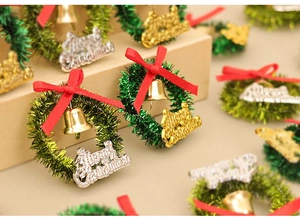 Miniature dollhouse Christmas wreaths with red bows and tiny golden bells decoration