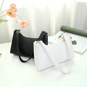 Minimalist faux leather underarm bags in black and white colors with sleek metal zippers