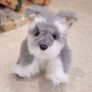 Realistic gray and white Schnauzer plush toy dog sitting on a soft carpet gift scene