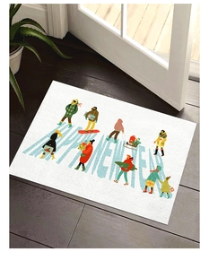 Close-up of Happy New Year bath mat with Christmas tree illustration on dark wood floor