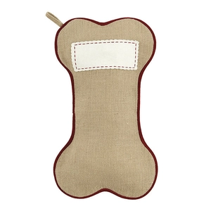 Dog bone shaped Christmas stocking made of beige burlap with red trim for pet holiday decor