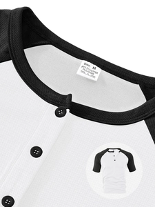 Close-up of color-block V-neck Henley shirt showing buttons and detailed fabric texture