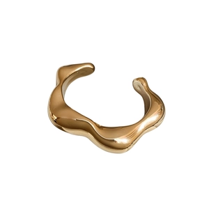 Minimalist irregular fluid wave open bangle with polished 18K gold mirror finish