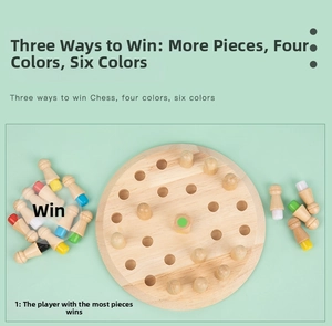 Close-up of wooden memory chess set with colorful pegs and board on green background