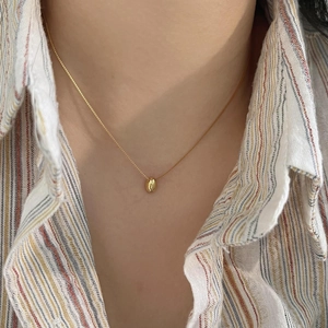 Minimalist 925 sterling silver gold bean pendant necklace on a delicate box chain