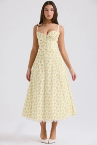 Detailed view of floral midi dress with delicate lace hem and summer spaghetti straps