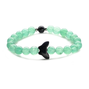 Beaded bracelet with light green aventurine beads and a black butterfly tail charm
