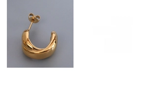Close-up of golden C-shaped twisted stud earrings with polished metallic finish