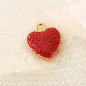 Polished red enamel heart pendant necklace in stainless steel with gold detail