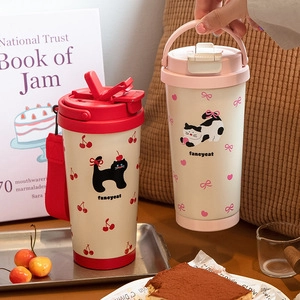Sealed tin canisters with cat patterns for coffee beans in a cozy tea time setting