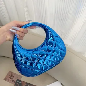 Close-up of a glossy electroplated blue cloud bag with classic diamond quilted texture