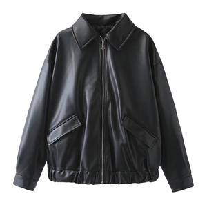 Detailed view of black PU leather jacket with silver metal zipper and elastic hem