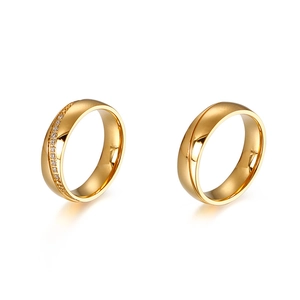 Polished 6mm gold stainless steel couple rings set with a single sparkling diamond inlay