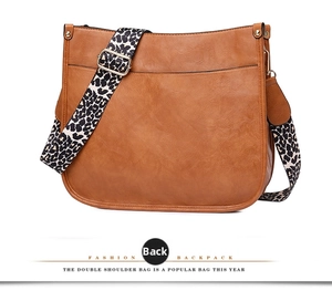 Brown faux leather tote bag with leopard print strap showing the back pocket detail
