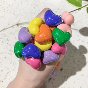 Close-up of vibrant candy-colored heart hair ties with high-elasticity purple bands