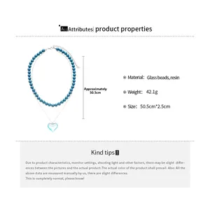 Detail view of double-layer beaded necklace with blue heart resin pendant and size data