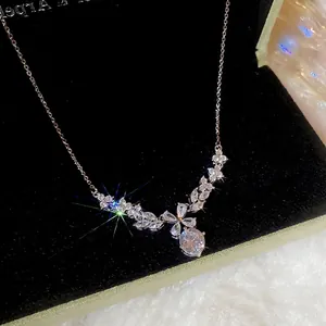 Sparkling zircon flower pendant necklace in silver finish on black velvet background