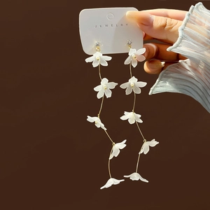 Elegant white resin petal tassel earrings with gold chain and clear crystal studs