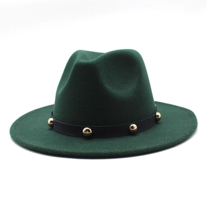 Detail of dark green wool felt fedora featuring black band with gold metal studs
