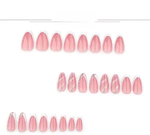 Detail of 24pcs white French press-on nails with silver glitter waves in almond shape