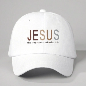 Close-up of the JESUS lettering and religious scripture print on a white cotton baseball cap