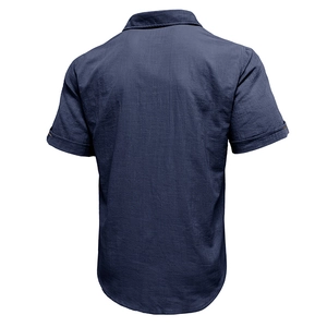 Detailed back view of men's short-sleeved navy cotton linen beach shirt with fabric texture