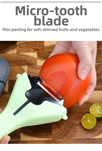 Close-up of light green serrated peeler slicing thin tomato skin on a wooden board