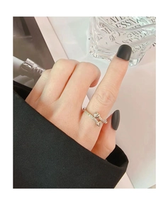 Close-up of sparkling heart-shaped zircon rings on a model finger with an open adjustable design