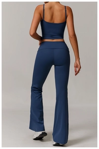 Rear view detail of dark blue yoga set featuring a cropped top and flared pants