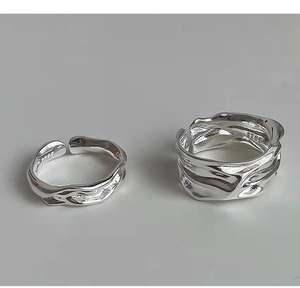 Detailed view of S925 silver rings featuring irregular lava texture and adjustable band