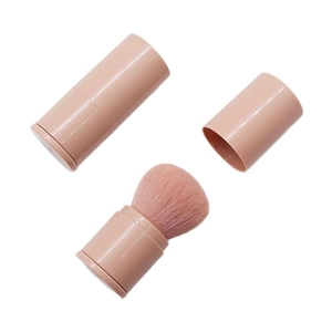 Portable pink retractable powder and blush makeup brush with protective cap
