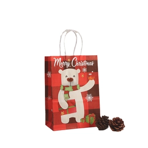Christmas kraft paper gift bag featuring a polar bear print on red and black plaid pattern