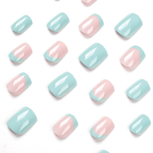 Short square French blue tips and mint green glossy press-on false nails set on white background