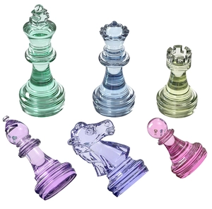 Macro shot of colorful resin chess pieces showing translucent crystal texture and detail