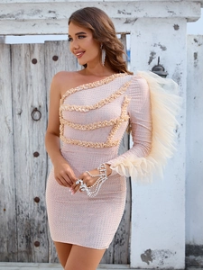 Detail of sequin fabric and ruffled mesh sleeve on champagne one-shoulder party dress