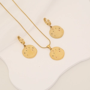 Golden snake-themed jewelry set with colored cubic zirconia necklace and earrings