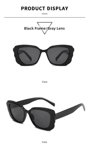 Close-up of butterfly frame sunglasses with wavy texture edges and gray lenses