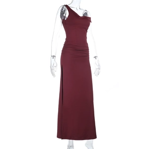 Detail view of burgundy one-shoulder slim fit dress featuring a side slit design