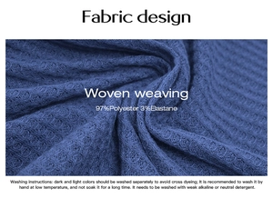 Detail of blue woven fabric showing 97% polyester and 3% elastane texture for romper