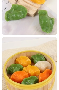 Detailed macro view of colorful PVC dumpling keychains in a bamboo steamer prop