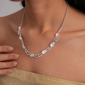 Detail of silver double-layer necklace featuring square and round zircon pavé crystals