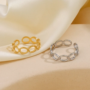 Polished hollow oval link open rings in gold and silver finish on silk background