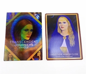 Close-up of Transcendent Journeys Oracle cards and holographic packaging box